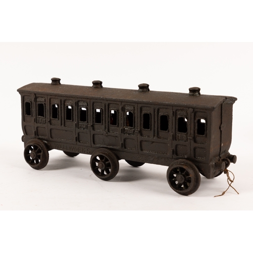 195 - A Henry Woolwork & Co, cast iron locomotive with tender and 3 coaches. dating from the late 19th cen... 