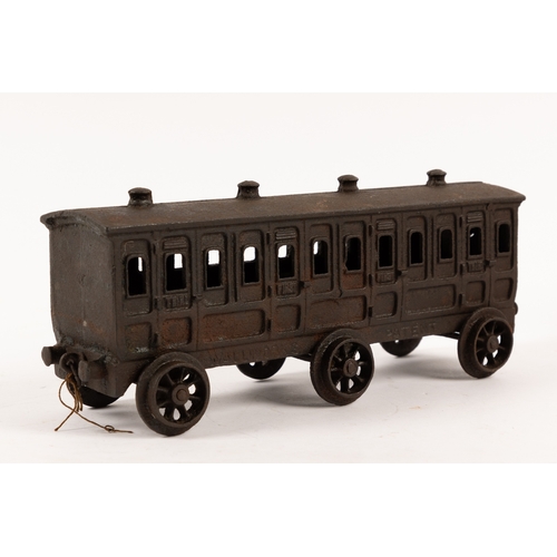 195 - A Henry Woolwork & Co, cast iron locomotive with tender and 3 coaches. dating from the late 19th cen... 