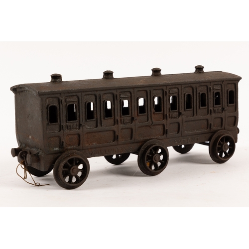 195 - A Henry Woolwork & Co, cast iron locomotive with tender and 3 coaches. dating from the late 19th cen... 