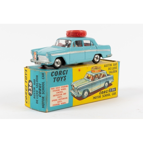 247 - Corgi Toys Motor School Car (236). An Austin A60 in light blue with red interior, with figures and r... 