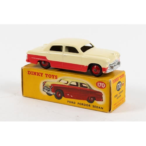 291 - Dinky Toys Ford Fordor Sedan (170). A lowline example, with red lower body and cream upper body with... 