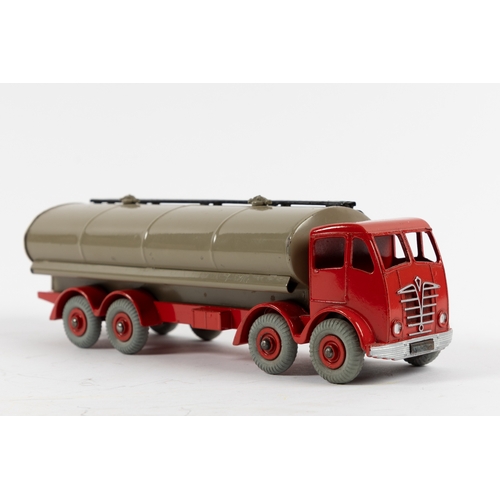 299 - A Dinky Supertoys Foden FG Petrol Tanker (504). A scarce example with red cab and chassis and fawn t... 