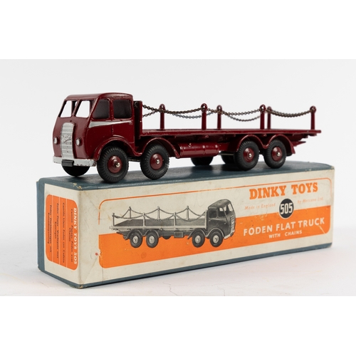 301 - A rare Dinky Supertoys Foden Flat Truck with chains (505). In maroon with silver flash to cab, maroo... 