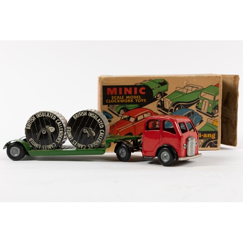 329 - A Tri-ang Minic Mechanical Horse & cable trailer. Red tractor unit with green trailer carrying 2 cab... 