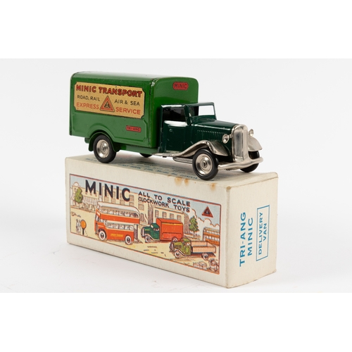 332 - A Tri-ang Minic delivery van with cark green cab and lighter box back, Decals applied to the side fo... 