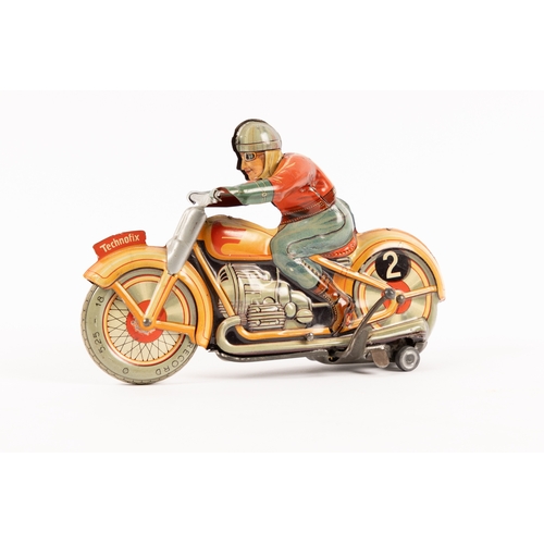 352 - A Technofix tinplate clockwork motor cycle. Registration No. GE255. In cream with red highlighting. ... 