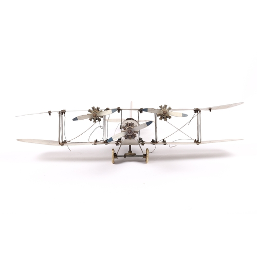 372 - An impressive Meccano tinplate Bi-Plane. Finished in silver RAF livery, fitted with a clockwork mech... 