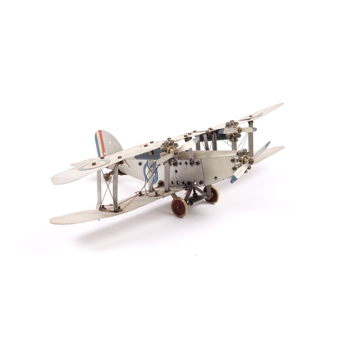 372 - An impressive Meccano tinplate Bi-Plane. Finished in silver RAF livery, fitted with a clockwork mech... 