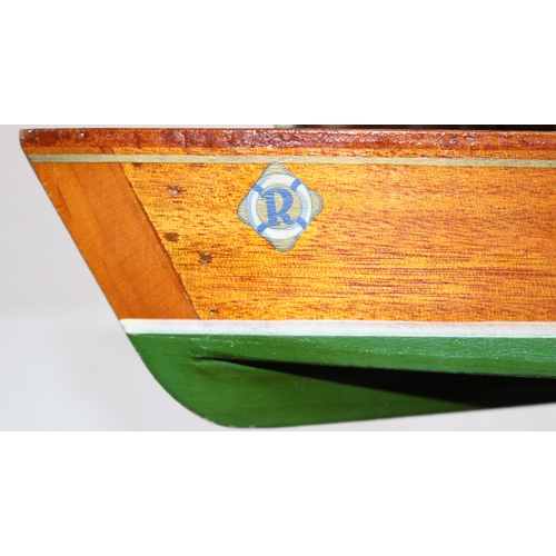 81 - A possibly Sutcliffe Wooden boat with R-CRAFT printed to each side. Has parts of the motor and some ... 