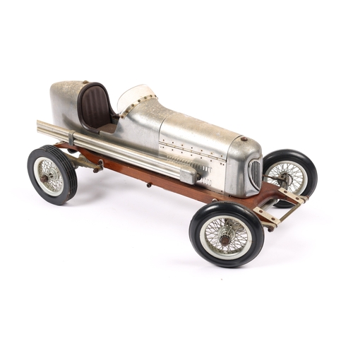 88 - A scarce aluminium body TETHER racing car with wooden chassis. Has large spoke wheels with rubber ty... 