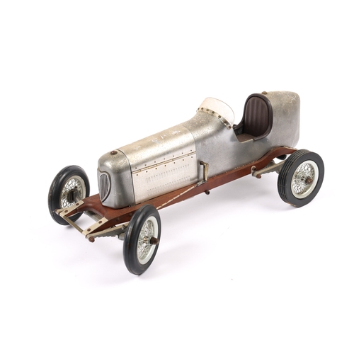 88 - A scarce aluminium body TETHER racing car with wooden chassis. Has large spoke wheels with rubber ty... 