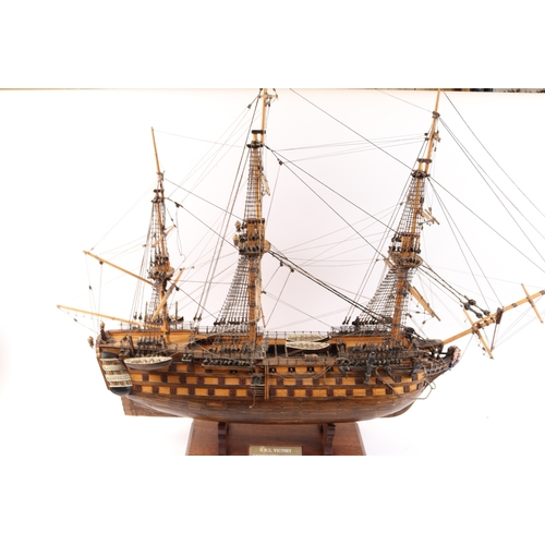 92 - An impressive model of HMS Victory. With fully detailed rigging but with no sails, 3 decks with cano... 