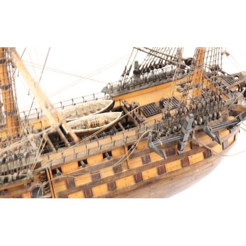 92 - An impressive model of HMS Victory. With fully detailed rigging but with no sails, 3 decks with cano... 