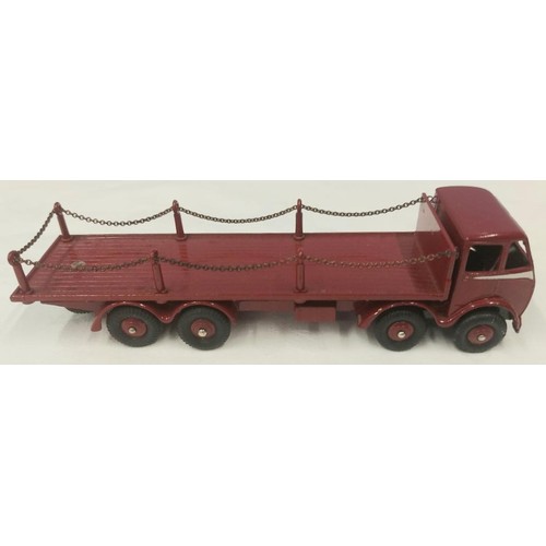 301 - A rare Dinky Supertoys Foden Flat Truck with chains (505). In maroon with silver flash to cab, maroo... 