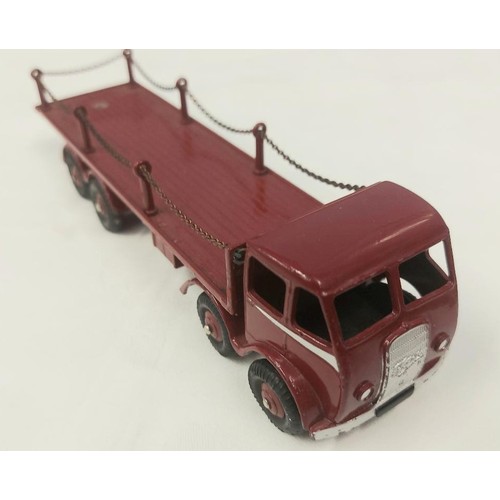 301 - A rare Dinky Supertoys Foden Flat Truck with chains (505). In maroon with silver flash to cab, maroo... 