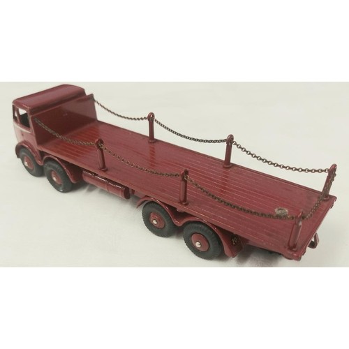 301 - A rare Dinky Supertoys Foden Flat Truck with chains (505). In maroon with silver flash to cab, maroo... 