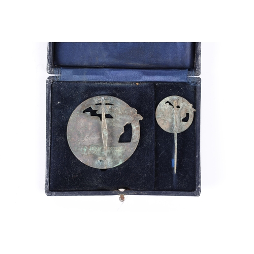 107 - A Third Reich Blockade Runner's badge and tie pin, in original case of issue. GC £200-250