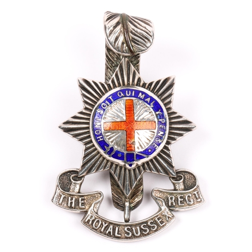 193 - A fine Royal Sussex Regiment officer's silver cap badge, red and blue enamelled centre, marked 