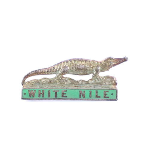 215 - A badge of the Sudanese White Nile Province Provincial Police, of white metal and enamel, with pin f... 