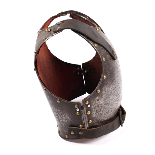 346 - An 18th century breast and backplate, edged with domed brass rivets and with replacement leather sho... 