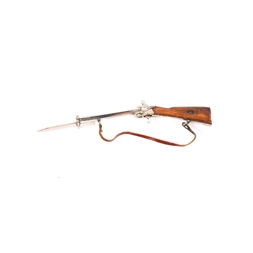 41 - An Austrian miniature pinfire rifle, bright nickel plated with wood sided butt, bayonet and leather ... 