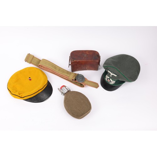 121 - A good quality replica of a Third Reich Zeltbahn, 2 peaked caps; a waterbottle, 2 belts and one othe... 