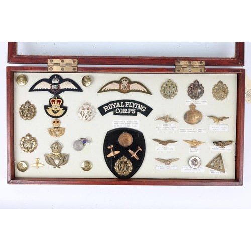 198 - A framed collection of Royal Flying Corps and Royal Air Force badges, including 3 RFC cap badges, RF... 