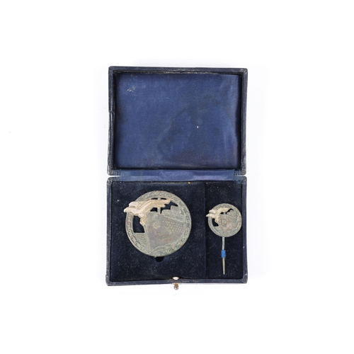 105 - A Third Reich Blockade Runner's badge and tie pin, in original case of issue. GC £150-200