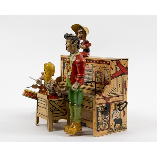 371 - A rare tinplate clockwork toy 'Lil Abner and his dog Patch Band'. Clockwork action makes the standin... 