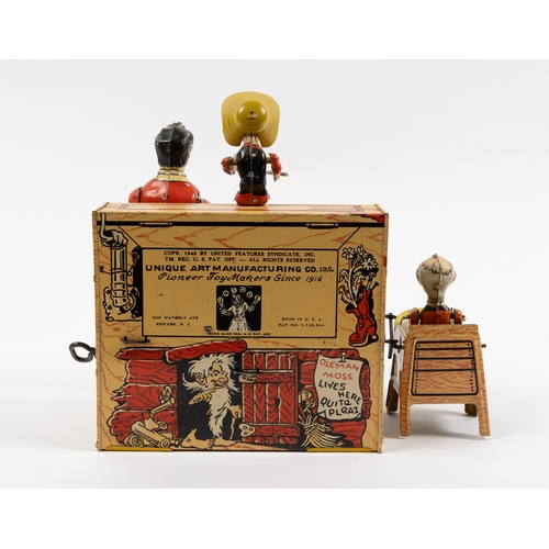 371 - A rare tinplate clockwork toy 'Lil Abner and his dog Patch Band'. Clockwork action makes the standin... 