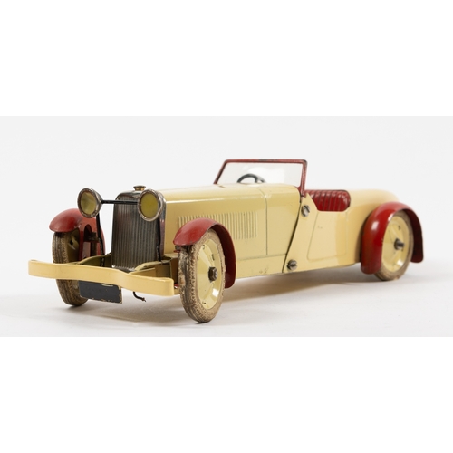 374 - A scarce Meccano clockwork No.1 Constructor Car. An open topped example in cream with red interior, ... 