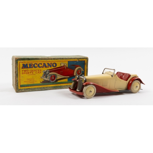 375 - A rare Meccano clockwork Non Constructor Car. A Two-Seater Sports Car in cream with red seats, mudgu... 