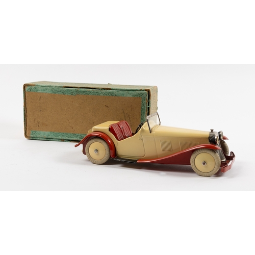 375 - A rare Meccano clockwork Non Constructor Car. A Two-Seater Sports Car in cream with red seats, mudgu... 