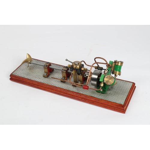 53 - A model boat 'V' twin live steam engine. Twin cylinders with oscillating valves with 'ahead' or 'ast... 