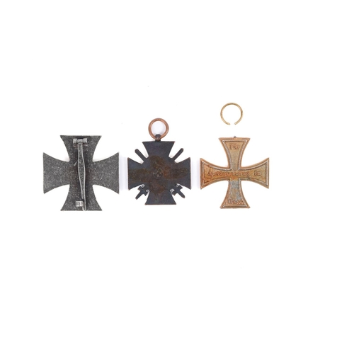 119 - A WWII Third Reich Iron Cross first class, also 2 WWI crosses. GC £130-150