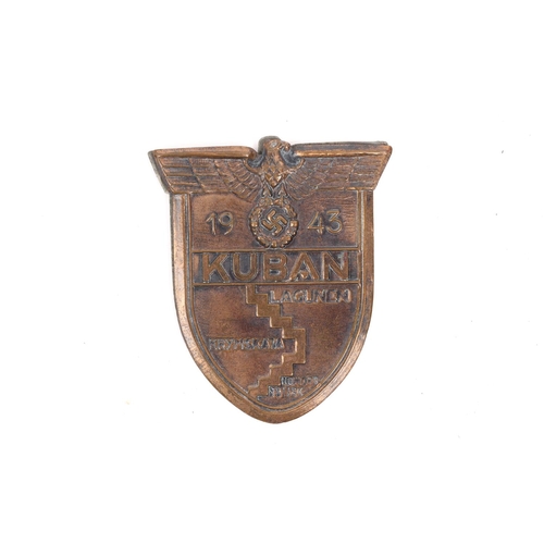 95 - A Third Reich Kuban arm shield, bronze finish, complete with backplate. VGC £100-120