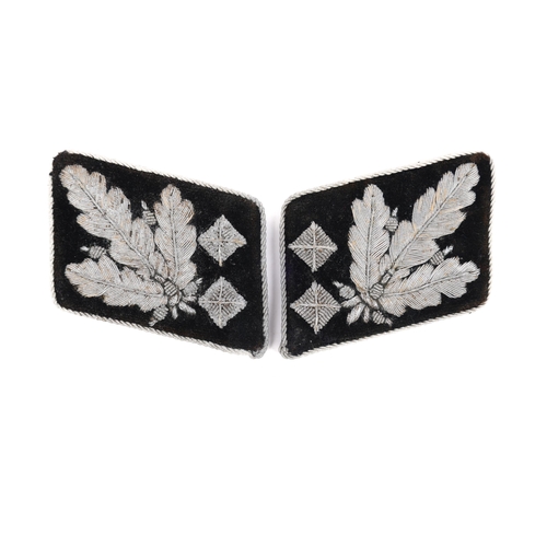 137 - A Third Reich pair of collar patches to a senior SS officer, alloy bullion embroidery on black velve... 