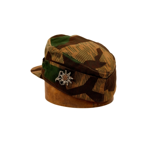 145 - A Third Reich man's Heer cap, camouflage printed material, woven badge, GC (sweat band removed) £70-... 