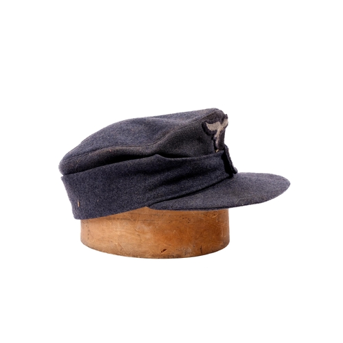 147 - A Third Reich Luftwaffe mans field cap, woven badges, buttoned flap, maker's name in liner 