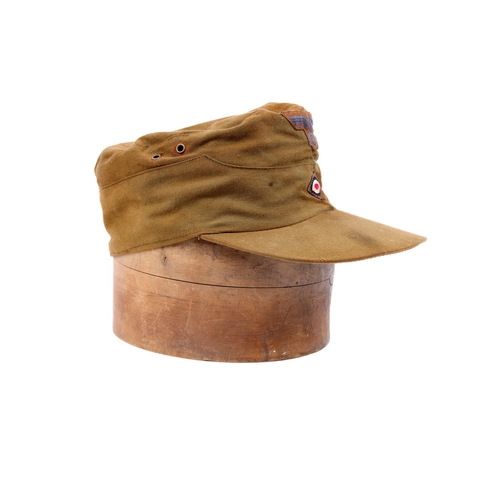 155 - A Third Reich D.A.K. type mans field cap, woven insignia on khaki material. VGC £70-80