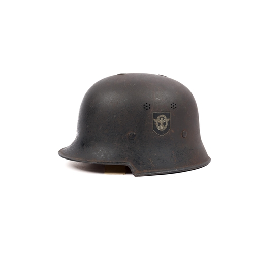 162 - A Third Reich Police mans helmet, retains much black finish, both decals intact, leather lining. GC ... 