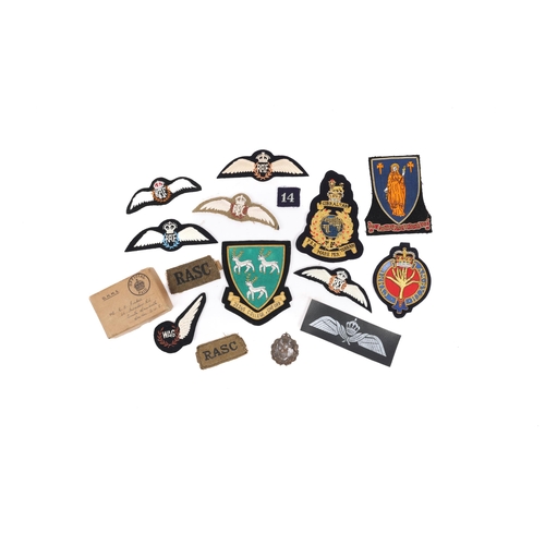 243 - A bronzed WW1 officer's Royal Flying Corps cap badge: 2 R.A.S.C. slip ons; and a quantity of blazer ... 