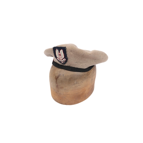 263 - An other ranks beret of the S.A.S, beige coloured with silk edging, woven badge. GC (some light moth... 