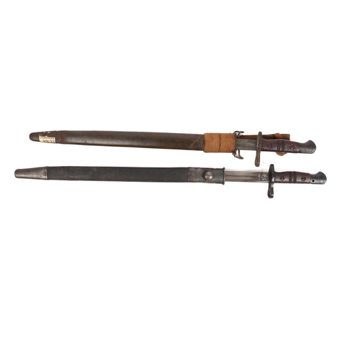 302 - A P17 bayonet in a 1907 pattern scabbard, GC; another in its scabbard, badly pitted. (2) £80-100