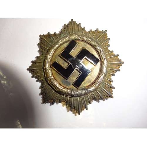 120 - A Third Reich German Cross in silver, dated 1941, named on reverse to 