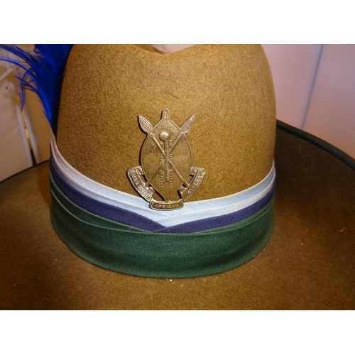 260 - An officer's scarce full dress shouch hat of the Rhodesian African Rifles, khaki felt with green sil... 