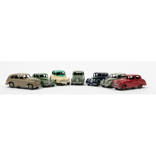 309 - 7 Dinky Toys. Morris Oxford in cream and green. 2x Riley in dark blue with black wheels and another ... 