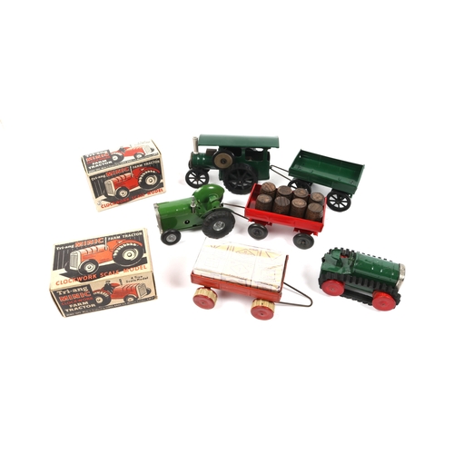 338 - 6 Tri-ang Minic. A Farm Tractor in green, boxed. 2 farm trailers, both red, one with round rubber tr... 