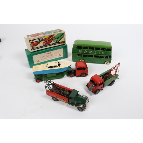 340 - 4 Tri-ang Minic Clockwork Vehicles. A Double Deck Bus, restored as a two tone green London Transport... 