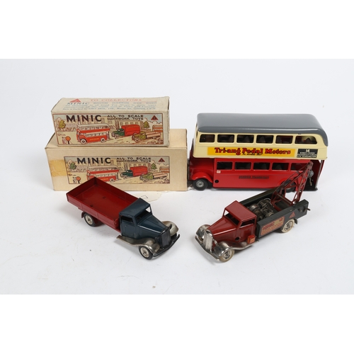 348 - 3 Tri-ang Minic Clockwork Vehicles. A well repainted Route 14 double decker bus in cream, red and gr... 